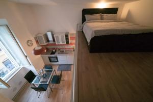 a small bedroom with a bed and a glass table at San Lorenzo 42 in Rome