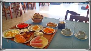 a table with plates of food on a table at Akrogiali in Kissamos