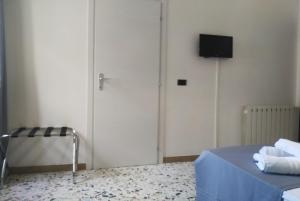 TV a/nebo společenská místnost v ubytování ALGHERO SEASIDE Guest House - Affittacamere