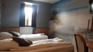 Ένα ή περισσότερα κρεβάτια σε δωμάτιο στο Hotel Velsen