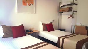 Postel nebo postele na pokoji v ubytování Hotel Umu