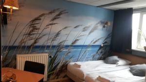 Ένα ή περισσότερα κρεβάτια σε δωμάτιο στο Hotel Velsen