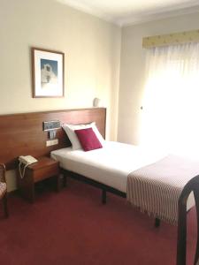 Postel nebo postele na pokoji v ubytování Hotel Umu
