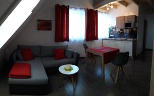 a living room with a couch and a table at Hotel Dietz in Bopfingen