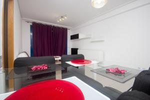 Televízia a/alebo spoločenská miestnosť v ubytovaní Style Apartment Patacona Beach