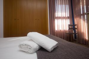Posteľ alebo postele v izbe v ubytovaní Style Apartment Patacona Beach