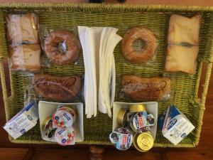 a basket filled with different types of bread and donuts at B&B Ca' da Lina in Deiva Marina