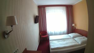 Postel nebo postele na pokoji v ubytování Hotel Christinenhof garni - Bed & Breakfast