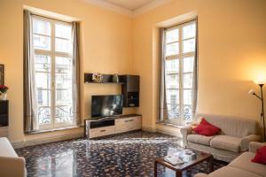 Televízia a/alebo spoločenská miestnosť v ubytovaní Nunziata Apartment