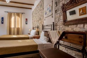 Postel nebo postele na pokoji v ubytování Cretan Villa Hotel