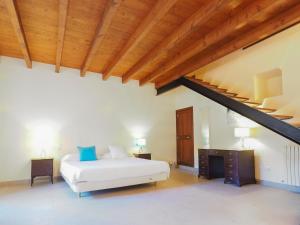 Łóżko lub łóżka w pokoju w obiekcie Casa Galileo