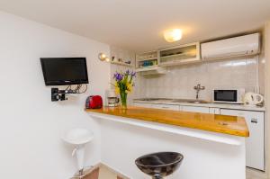 Kuchyň nebo kuchyňský kout v ubytování Apartments Simović