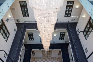 an overhead view of a chandelier in a building at Hotel President in Budapest