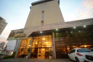 a building with cars parked in front of it at Hotel Bertaso in Chapecó