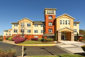 a hotel building with a parking lot in front of it at Extended Stay America Suites - Columbia - Northwest Harbison in Columbia