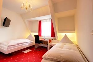 Postel nebo postele na pokoji v ubytování Hotel Linde