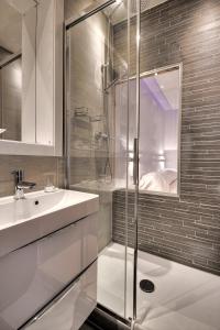 a white bathroom with a shower and a sink at Da Domenico Am Hagelkreuz in Hilden