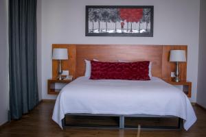 Ένα ή περισσότερα κρεβάτια σε δωμάτιο στο AMD Hotel