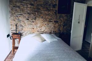 Postel nebo postele na pokoji v ubytování El Baluard