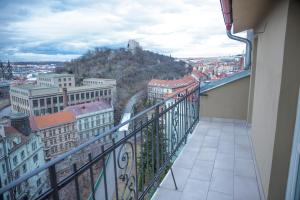 a balcony with a view of a city at Gregory House in Prague