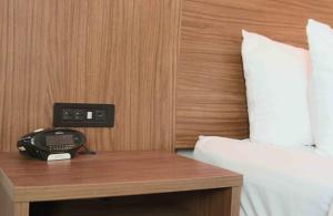 Ένα ή περισσότερα κρεβάτια σε δωμάτιο στο Kalika Hotel