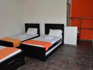 Postel nebo postele na pokoji v ubytování Hotel Campestre La Toscana