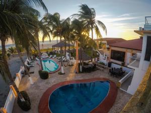 an aerial view of a resort with a swimming pool at Hotel Villa Murano in Puerto Arista