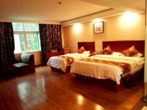 Krevet ili kreveti u jedinici u objektu GreenTree Inn Anhui Huangshan Tunxi Old Street Business Hotel