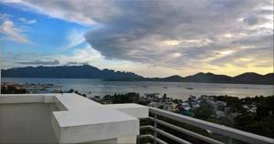 a view of the water from the balcony of a building at SunValley Tourist Inn in Coron