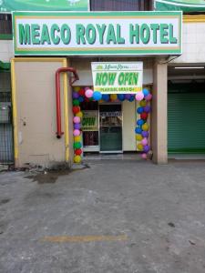 a mexico royal hotel with a sign in front of a building at Meaco Royal Hotel - Plaridel in Plaridel