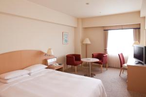 Postel nebo postele na pokoji v ubytování Hotel Hewitt Koshien