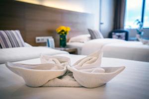 Postel nebo postele na pokoji v ubytování Crystal Crown Hotel Petaling Jaya