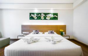 Postel nebo postele na pokoji v ubytování Crystal Crown Hotel Petaling Jaya