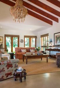 a living room with a couch and a table at La Casa Compartida in Southbroom