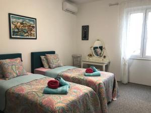 Posteľ alebo postele v izbe v ubytovaní Apartment KAPO