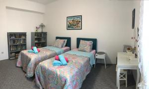 Posteľ alebo postele v izbe v ubytovaní Apartment KAPO