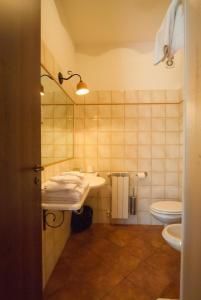 a bathroom with a sink and a toilet at Poggiofelice B&B in Zafferana Etnea