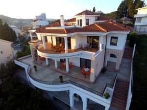 an overhead view of a white house with a deck at Apartments Kan in Ulcinj