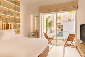TV a/nebo společenská místnost v ubytování Hotel J, Unawatuna