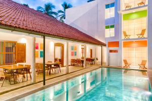 an image of a villa with a swimming pool at Hotel J, Unawatuna in Unawatuna