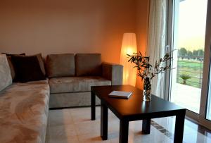 a living room with a couch and a table at Marathon Eco Stay in Marathon