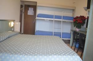 Ein Bett oder Betten in einem Zimmer der Unterkunft Hotel Svizzera