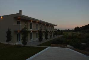 a large building with a pathway in front of it at Marathon Eco Stay in Marathon