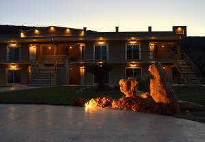 a house with a fire fountain in front of it at Marathon Eco Stay in Marathon