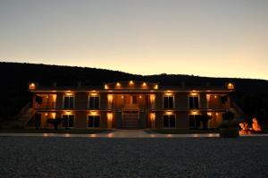 a large house with lights on it at night at Marathon Eco Stay in Marathon
