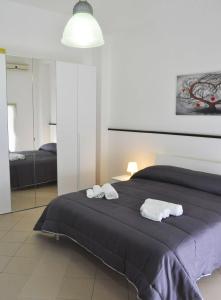 A bed or beds in a room at ragusa curtigghiu