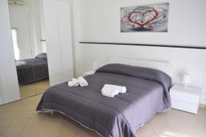 A bed or beds in a room at ragusa curtigghiu