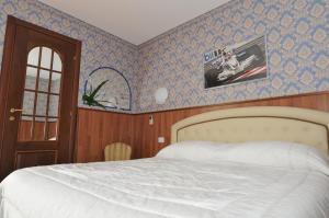 Rúm í herbergi á Hotel Fossati