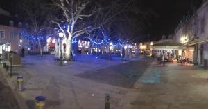 a city street at night with blue lights at Loft Zola in Dijon