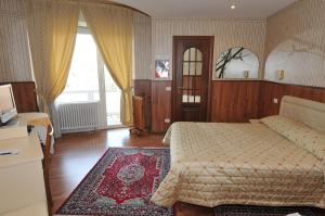 Rúm í herbergi á Hotel Fossati